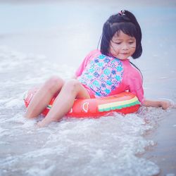 Portrait of cute girl in water