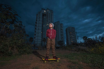 Man standing against sky at night