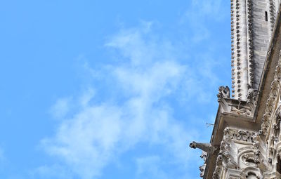 Low angle view of statue against blue sky