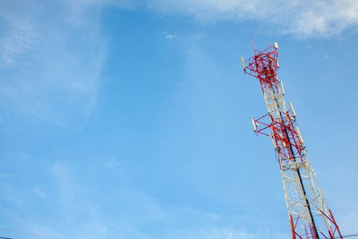 Low angle view of communications tower against sky