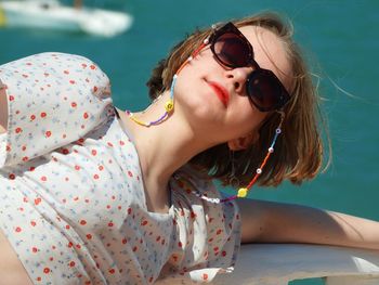 High angle view of girl wearing sunglasses in swimming pool