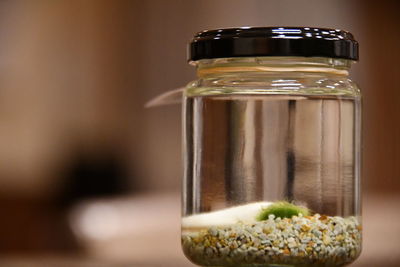 Close-up of glass of jar on table