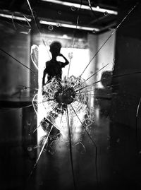 Close-up of silhouette people on glass window