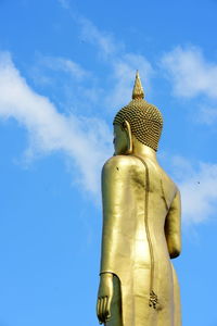 Low angle view of statue against blue sky