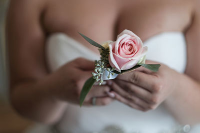 Close-up of bride holding rose