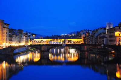 Night view of townscape at the edges of   arno river, florence, italy.