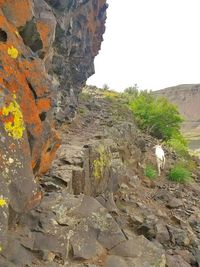 Rock formations on landscape against sky