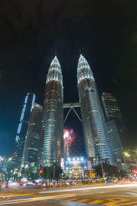 Illuminated modern buildings in city at night