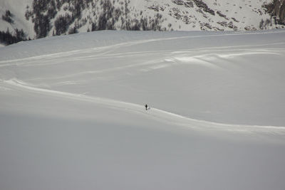 High angle view of person on snow covered field