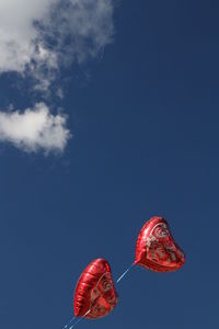 Low angle view of red balloon in mid-air