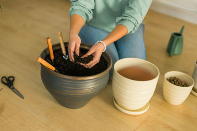 Midsection of woman preparing food on table