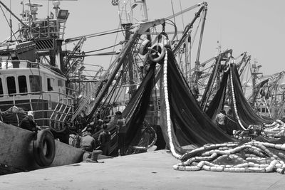 Panoramic view of boats moored against sky