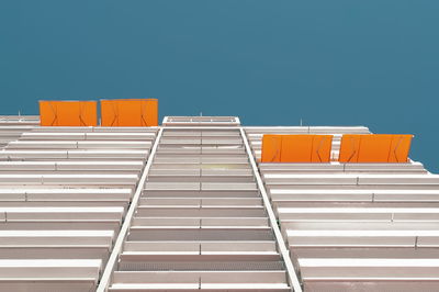 Low angle view of office building against clear sky