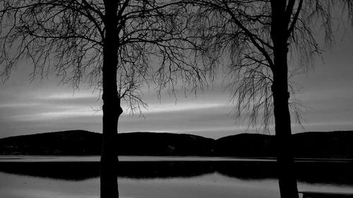 Scenic view of lake at sunset