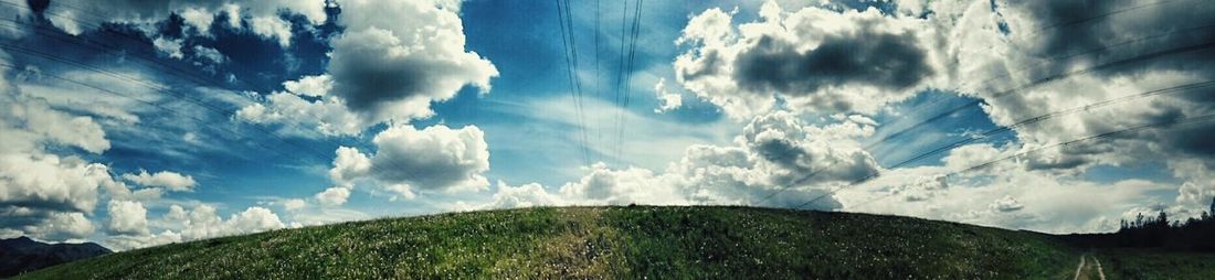 Scenic view of landscape against cloudy sky