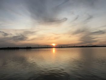 Scenic view of lake against sky during sunset