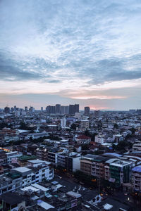 High angle view of buildings against sky at sunset