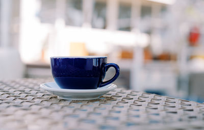 Close-up of coffee cup on table