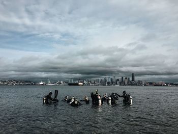 Cityscape against cloudy sky