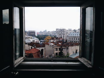 View of cityscape through window