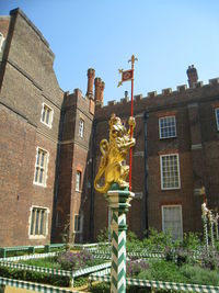 Low angle view of statue against sky in city