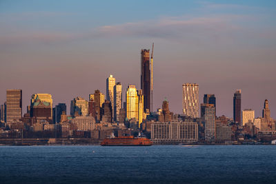 Sunset clouds moving over brooklyn downtown with new construction building