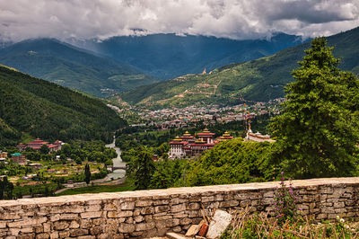 Panoramic view of buildings and mountains against sky