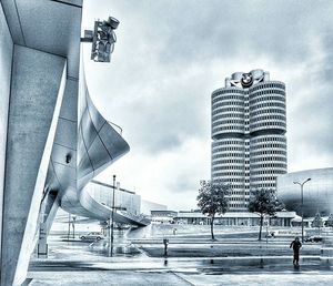 Low angle view of buildings against cloudy sky