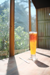 Glass of drink on table