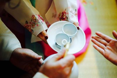 Close-up of woman holding tea cup