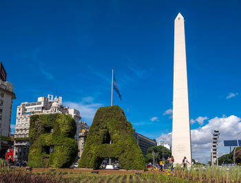 Low angle view of tower against blue sky