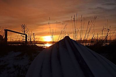 Scenic view of snow covered mountains against sky during sunset