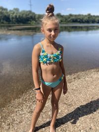 Full length of woman standing at beach