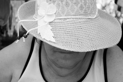 Close-up of person wearing sun hat