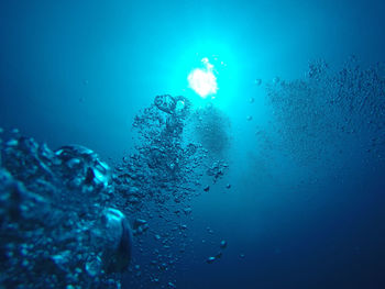 Close up of bubbles against blue sky