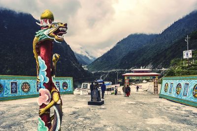 People at town square against sky