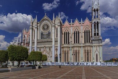 Facade of historic building against sky