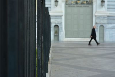 Rear view of woman walking in building