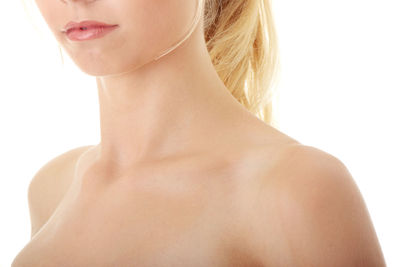 Close-up of woman against white background