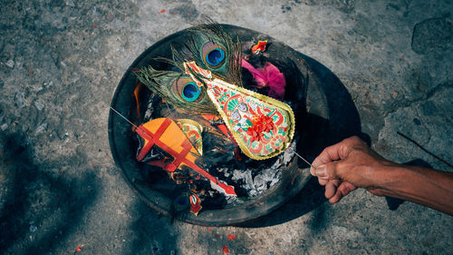 High angle view of man working in multi colored umbrella