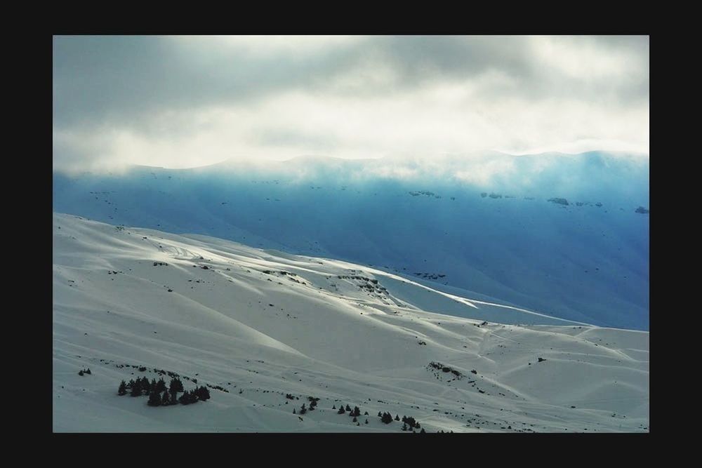 transfer print, tranquil scene, auto post production filter, sky, scenics, snow, mountain, tranquility, beauty in nature, cloud - sky, winter, landscape, cold temperature, nature, weather, mountain range, cloudy, cloud, idyllic, non-urban scene