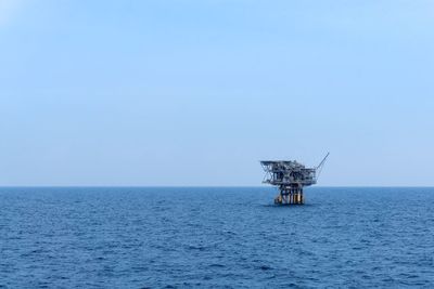 An isolated tripod satellite oil production platform at offshore terengganu oil field