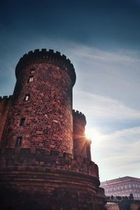 Low angle view of old ruin building against sky