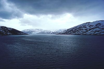 Scenic view of snowcapped mountain against sky