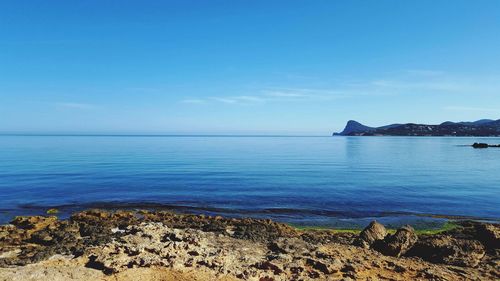 Calm blue sea against the sky