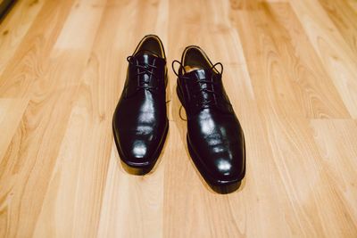 High angle view of shoes on hardwood floor