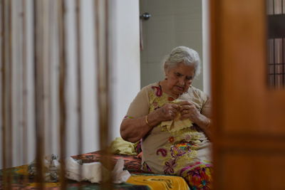 Woman sitting at home
