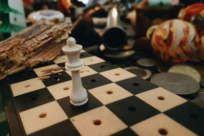 Close-up of chess pieces on table