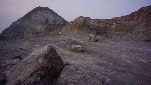 Rock formations in desert against sky