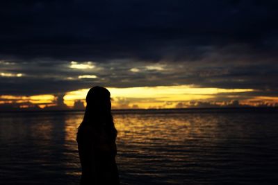 Scenic view of sea against cloudy sky